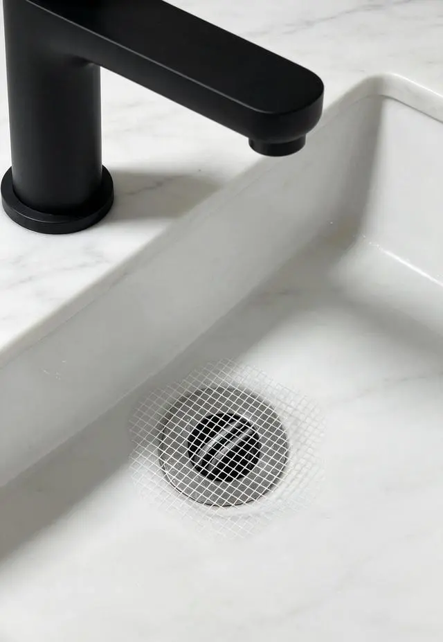 Alt view image 3 of 6 - Disposable Shower Drain Hair Catcher Mesh Stickers 20 Pack | FlowerShape Adhesive Drain Protector, Traps Human & Pet Hair, Prevents Clogs, Smooth Water Flow for Shower, Bathtub & Sink