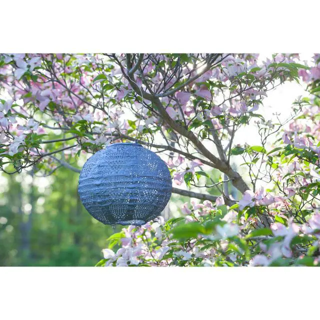 Alt view image 4 of 7 - Soji Stella Globe 8" LED Outdoor Solar Lantern, Handmade with Weather-Resistant UV Treated Fabric, Stainless Steel Hardware, Auto Sensor on/Off, for Patio, Deck, Garden (Metallic Blue)