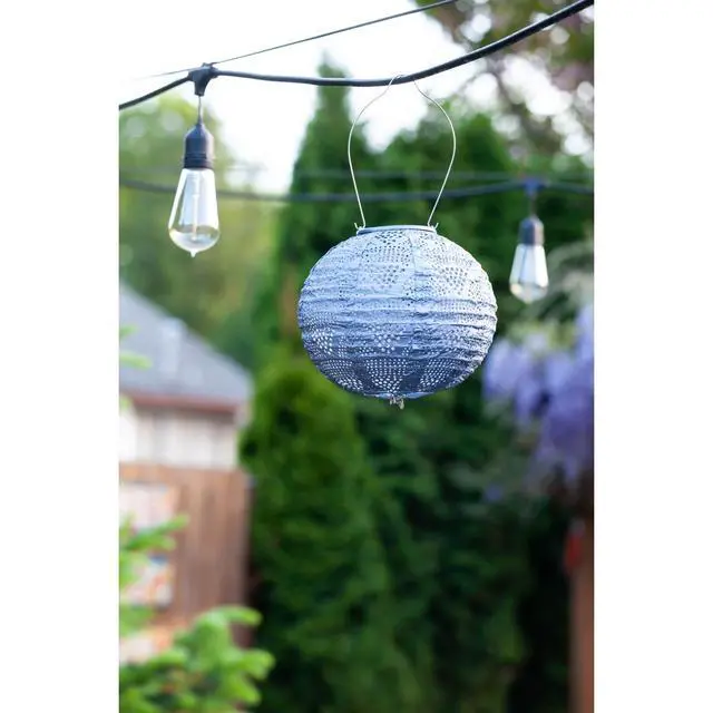 Alt view image 6 of 7 - Soji Stella Globe 8" LED Outdoor Solar Lantern, Handmade with Weather-Resistant UV Treated Fabric, Stainless Steel Hardware, Auto Sensor on/Off, for Patio, Deck, Garden (Metallic Blue)