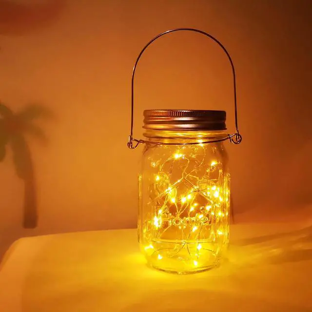 Alt view image 2 of 7 - Solar Mason Jar Lights,4 Pack 30 Led Starry Fairy String Hanging Jar Lights,Solar Lanterns for Outdoor Patio Party Garden Wedding Halloween Christmas Projector Decor Light(Mason Jars/Handles Included)