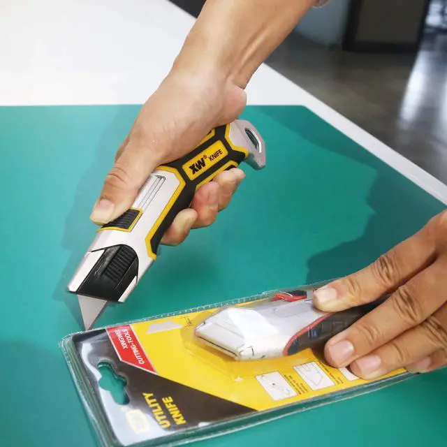 Alt view image 4 of 7 - Auto-Retractable Safety Utility Knife, Box Cutter of Quick Blade Change, 4 Spare Blades Storage in Handle