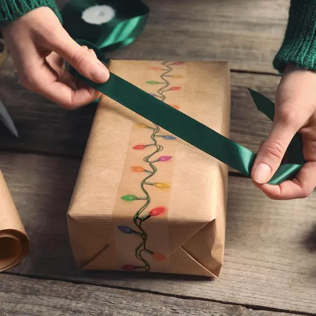 Alt view image 2 of 5 - Genuine Fred Special DELIVERY Holiday Packing Tape, Fun String Lights Design, 60ft Roll with Built-in Dispenser, Perfect for Shipping, Holiday Gifts, and Fun Packaging, Printed Packing Tape