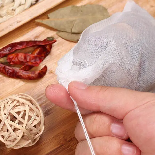 Alt view image 5 of 7 - 100Pcs Large Tea Bag - Disposable Empty Tea Filter Bags No Mess Mesh Bags with Drawstring for Concentrate/Iced Coffee, Herb, Loose Leaf Tea