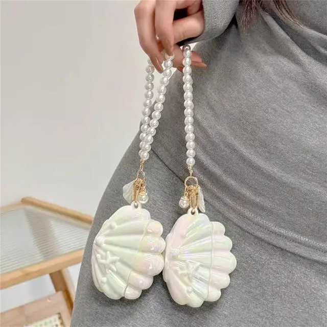 Alt view image 5 of 6 - Case for AirPods 2nd/1st Generation with Pearl Wrist Chain,Beautiful Creative Glitter 3D Headphone Protective Shell for Air Pod 1 & 2 Cover for Girls Women (Seashell)