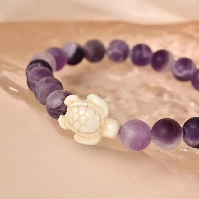 Alt view image 6 of 7 - Sea Turtle Tracking Bracelet Amethyst, helps save sea turtles, one size fits most Men and Women