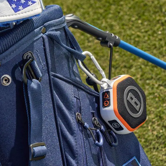 Alt view image 5 of 7 - Bushnell Golf Wingman Mini GPS Speaker (Orange/White) | Magnetic Mount, Music & Audible Distances for 38,000+ Courses, Carabiner Clip, Waterproof, 36-Hole Battery, with Signature Series Gift Bundle