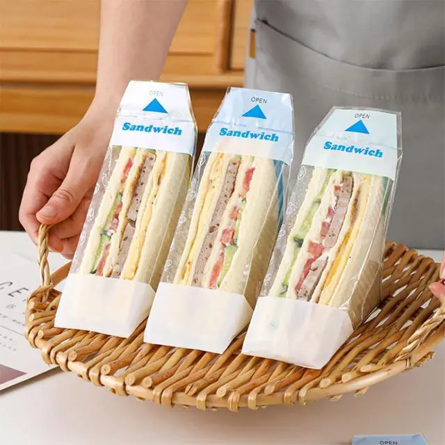 Alt view image 3 of 6 - 100Pcs Plastic Sandwich Wrapping Paper Clear Sandwich Container Bags Easy Tear Disposable Triangle Bread Wrappers