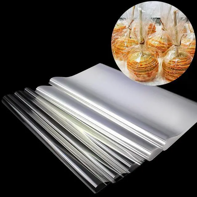 Main image of SYOGUA 150 Pieces Cellophane Sheets, 12 x 12 inches 3 Mil Thick Gift Wrap, Crystal Clear Candy Wrappers for Treats, Candies, Cake Pops, Henna Cones, DIY Crafts