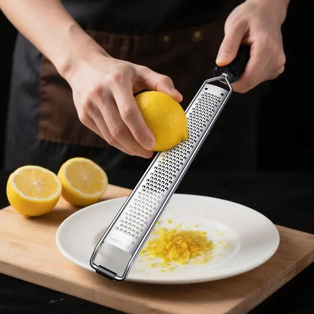 Alt view image 3 of 6 - Lemon Zester and Cheese Grater with Secure-Grip Handle - Stainless Steel, 15x1.4 inches