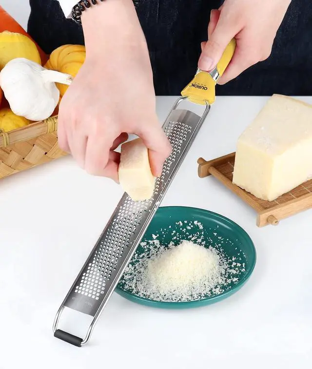 Alt view image 5 of 5 - Ourokhome Kitchen Lemon Zester, Stainless Steel Hand Held Parmesan Cheese Grater for Ginger, Chocolate, Coconut, Lime, Nutmeg, Citrus, Fruit, Vegetable with Cleaning Brush, Dishwasher safe, Yellow