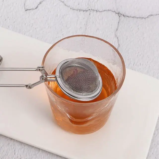 Alt view image 7 of 7 - Silver Snap Ball Tea Strainer with Handle,Tea Strainer Ball Stainless Steel Tea Infuser Filter for Loose Leaf Tea Spices Seasonings Kitchen and Dining (Large)