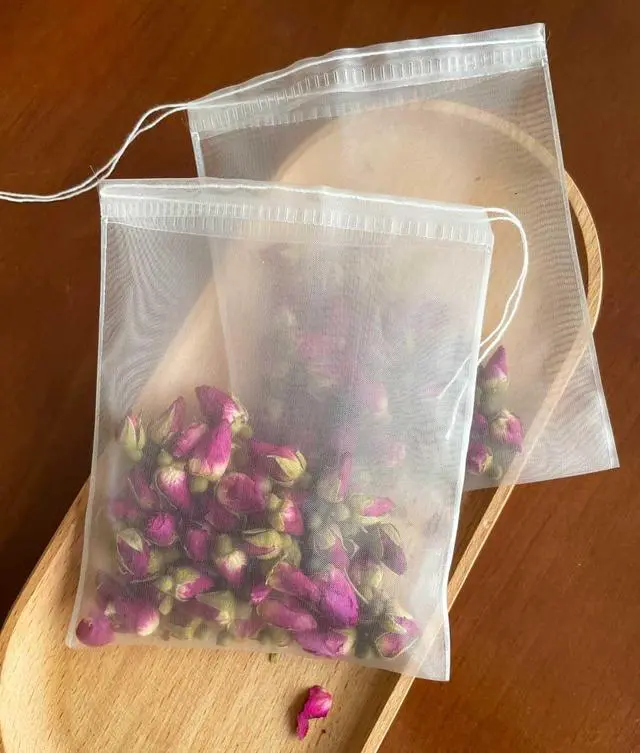 Main image of 50Pcs Empty Pyramid Nylon Tea Bags Mesh Tea Infuser Bag Herb Spice Filter Strainer Bags With String (3.93x4.7inch)