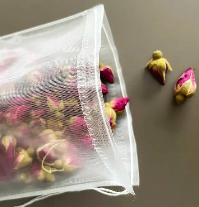 Alt view image 3 of 7 - 50Pcs Empty Pyramid Nylon Tea Bags Mesh Tea Infuser Bag Herb Spice Filter Strainer Bags With String (3.93x4.7inch)