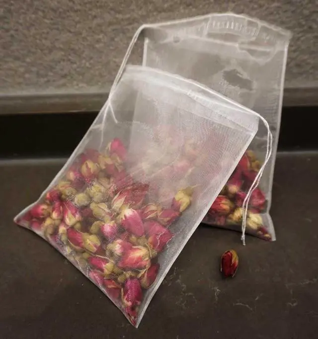 Alt view image 4 of 7 - 50Pcs Empty Pyramid Nylon Tea Bags Mesh Tea Infuser Bag Herb Spice Filter Strainer Bags With String (3.93x4.7inch)