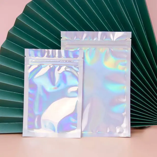 Alt view image 6 of 7 - 100 Pieces Resealable Smell Proof Bags - 4 x 6 Inches Foil Pouch Bags Flat Clear Food Storage Bags Plastic Packaging Foil Mylar Bags for Party Favor Food Storage (Holographic Rainbow Color)