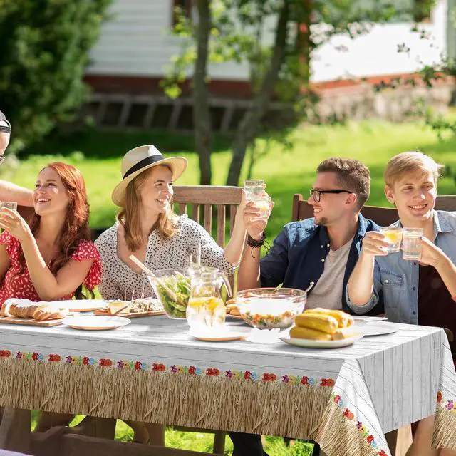Alt view image 7 of 7 - Kochorie 2 Pack Hawaii Luau Grass Tablecloth 54 x 108 Inches Waterproof Plastic Hawaiian Brown Grass Table Skirt with Raffia Libiscus Flowers Table Cover for Summer Tropical Party Decorations