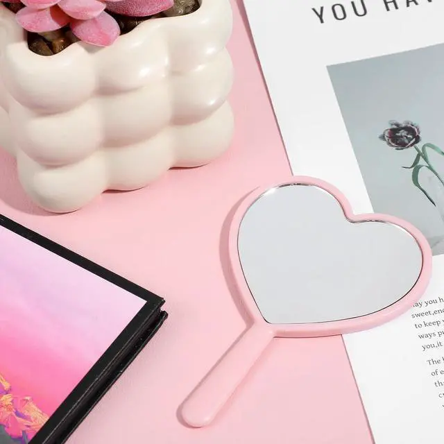 Alt view image 3 of 6 - Bremorou Heart Shaped Handheld Cosmetic Mirrors Lash Mirror Handheld Portable Mini Travel Makeup Mirrors with Handle for Women, Pink, 4.72 × 3.14 inches(Mini)