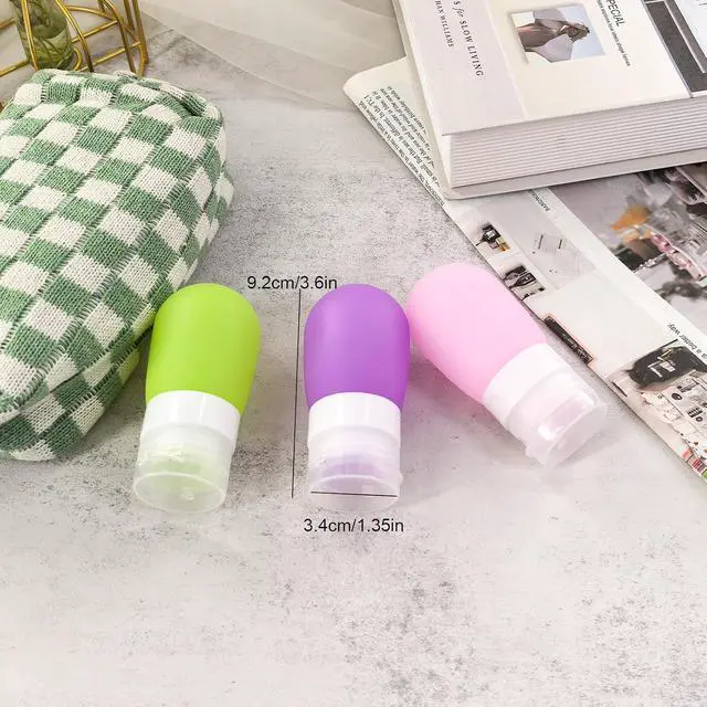 Alt view image 3 of 7 - Mziart Travel Bottles for Toiletries, TSA Approved 2oz Silicone Travel Size Containers, 3 Pack Leak-Proof Squeezable Refillable Shampoo and Conditioner Bottles (Pink, Purple, Green)