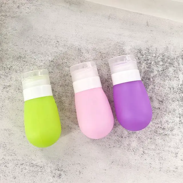 Alt view image 4 of 7 - Mziart Travel Bottles for Toiletries, TSA Approved 2oz Silicone Travel Size Containers, 3 Pack Leak-Proof Squeezable Refillable Shampoo and Conditioner Bottles (Pink, Purple, Green)