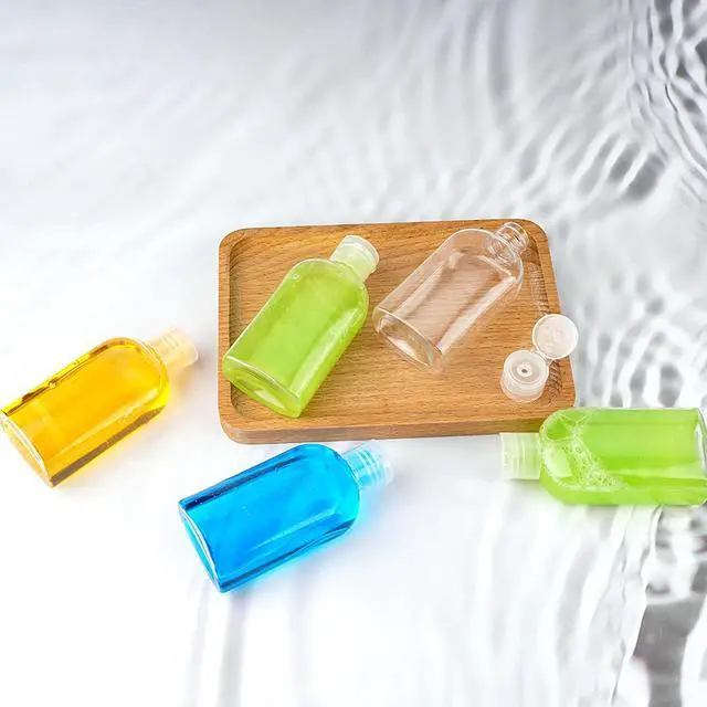 Alt view image 3 of 6 - Travel Bottles for Toiletries 5-Pack Squeeze Bottle with Flip Caps | Refillable Leak Proof TSA Approved 3.4oz/100ml Small Bottles for Shampoo, Conditioner, Lotion and Cosmetics