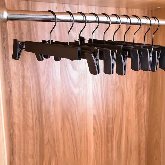 Alt view image 7 of 7 - Pants Hangers with Clips, Skirt Hangers, 10 Pack, Black | Plastic clip hangers for pants, skirts, jeans and shorts; 360° swivel hooks help save closet space.