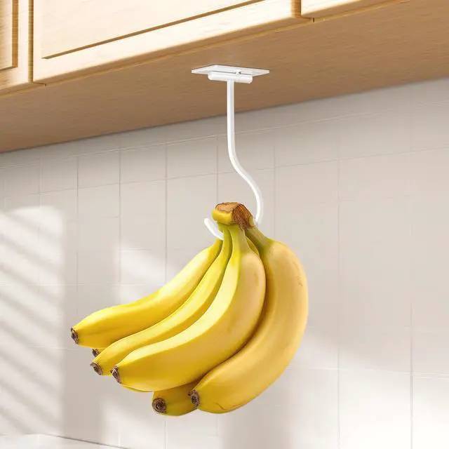 Alt view image 2 of 7 - Banana Hook Under Cabinet Adhesive, Under Counter Banana Hanger, White | Foldable Banana hook, Metal Banana Holder, Hold 20 Bananas, Space-Saving Design, Folding with Magnets When Not in Use