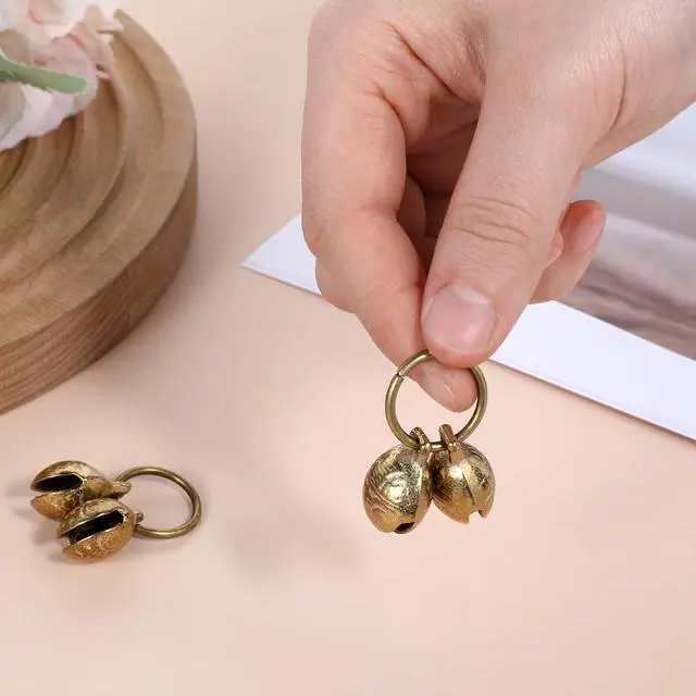 Alt view image 4 of 7 - Styquenzer Copper Bell for Dog Collar, 4 PCS Brass Dog Bells Extra Loud Collar Bell for Pet Tracking Anti Lost Training Pets Pendant Accessories Anti Theft Bells for Little Dogs & Cats