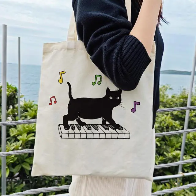 Alt view image 2 of 6 - Dlzdn Black Cat Canvas Tote Bag For Women Aesthetic Funny Cute Cat Playing Piano Tote Bag Shopping Grocery Bag Beach Bag Gifts for Women Teacher Bag Reusable Grocery Bag