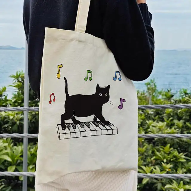 Alt view image 4 of 6 - Dlzdn Black Cat Canvas Tote Bag For Women Aesthetic Funny Cute Cat Playing Piano Tote Bag Shopping Grocery Bag Beach Bag Gifts for Women Teacher Bag Reusable Grocery Bag