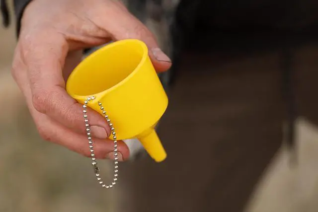 Alt view image 3 of 6 - Coghlan's High-Strength Polypropylene Funnel with Brass Strainer, Ideal for Refilling Camp Stoves and Lanterns with Fuel; Mess-Free Design for Quick and Easy Pouring at Campsites and Home