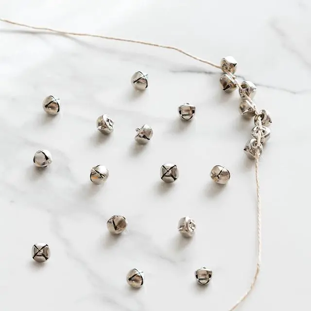 Alt view image 3 of 7 - Affordable 18-PC Silver Jingle Bells 0.375" 9.5mm Holiday, Home Décor & Craft Projects, Decor Wreaths or Pet Collar & Hear The Jingling Chimes, Napkin Rings, Jewelry, Gift Wrap Bells for Crafts.