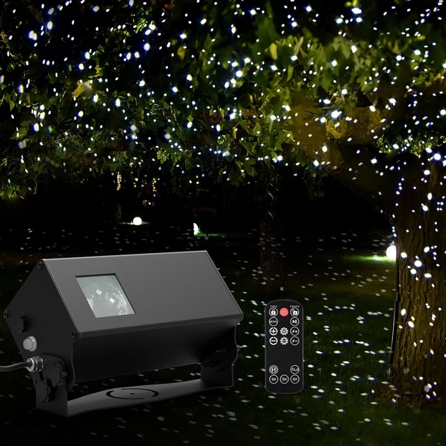 Main image of White Laser Outdoor Light Projector, 3 Modes Christmas Snowflake & Fairy Lights with Remote for Home, Garden & Trees