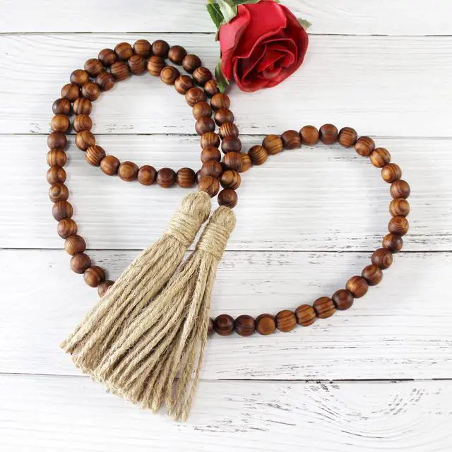 Alt view image 5 of 7 - CVHOMEDECO. Wood Grain Beads Garland with Tassels Farmhouse Rustic Wooden Prayer Bead String Wall Hanging Accent for Home Festival Decor. Dark Tan