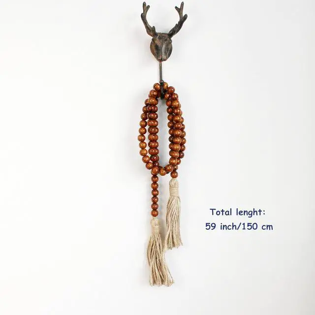 Alt view image 6 of 7 - CVHOMEDECO. Wood Grain Beads Garland with Tassels Farmhouse Rustic Wooden Prayer Bead String Wall Hanging Accent for Home Festival Decor. Dark Tan