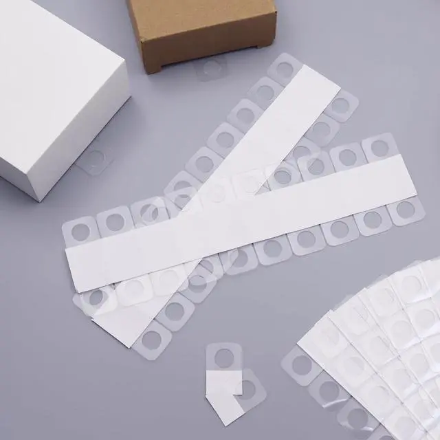 Alt view image 7 of 7 - 300PCS Clear Self Adhesive Hang Tabs, Slot Hole Sticky Hang Tabs Plastic Retail Hanging Tags Sticky Hanging Display Hook for Store Retail Items Display (1.3x0.9 Inch)