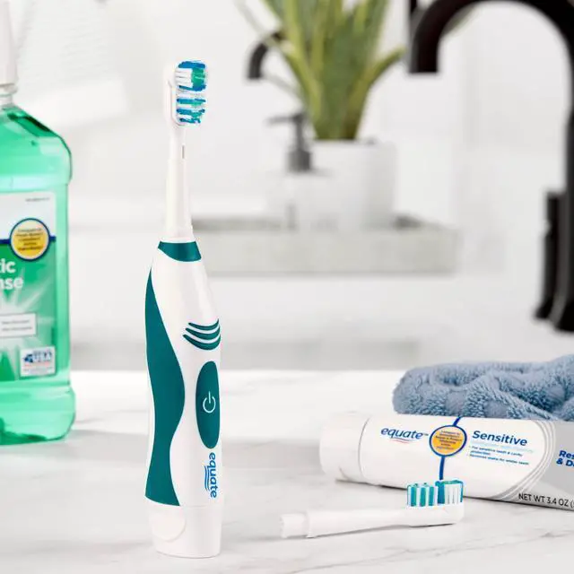 Alt view image 4 of 6 - Equate Advanced Dual Action Battery-Powered Electric Toothbrush with 2 Replacement Heads, White