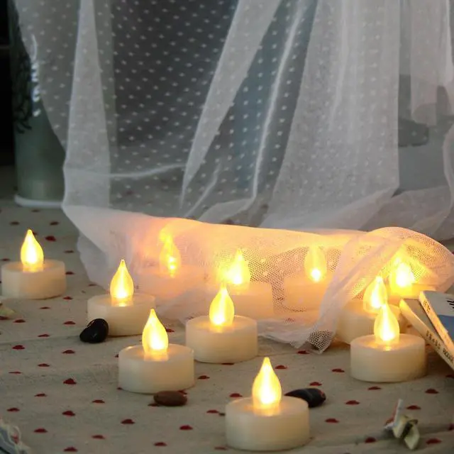 Main image of 6 Flameless Tealight Candles with Remote and Timer Flickering Battery Operated Electric LED Tea Lights Halloween Jack-O-Lantern Pumpkin Wedding Centerpieces Christmas Party Decorations Batteries Incl.