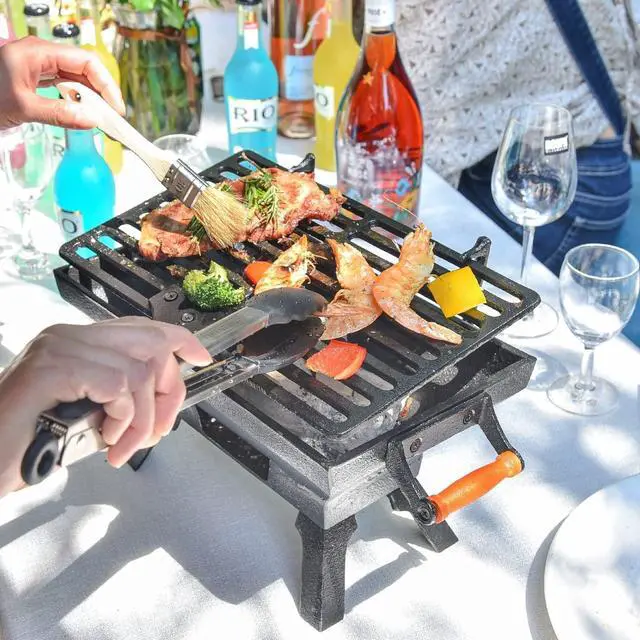 Alt view image 2 of 7 - Compact Cast Iron Tabletop Charcoal Grill with Adjustable Grate and Wooden Handles, Portable Heavy-Duty BBQ Grill for Camping Balcony and Small Spaces