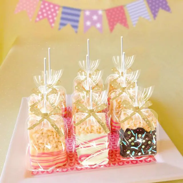 Alt view image 4 of 7 - 50-Pack Clear Rice Crispy Treats Bag and Sticks, Treats Wrappers Kit, Gold | Rice Crispy Treat Wrappers Kit, Treat Packaging Holder, Clear Plastic Container, Gold Ribbon, for Halloween, Party Supplies