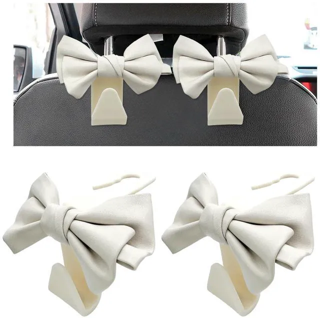 Main image of 2 PCS Car Seat Headrest Hooks, Cute Bow Shaped Vehicle Backseat Purse Holder Storage Hook, Bow Knot Seat Back Hooks Hanging Organizer for Coat Umbrellas Grocery Bag (White)