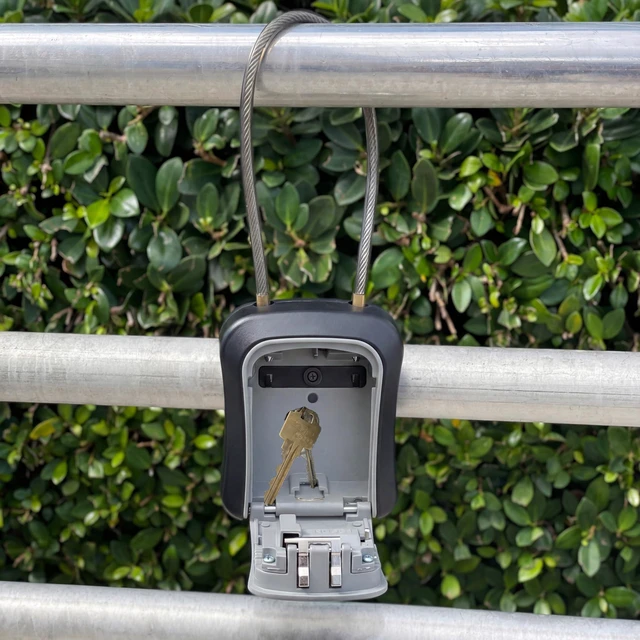 Alt view image 5 of 7 - ® Medium Key Lock Box with Code, 15-in Steel Cable Shackle (Grey) Built-in key hooks + catch tray; hangs on handles, gates, fences or a hasp; wall-mountable; dial cover; no batteries