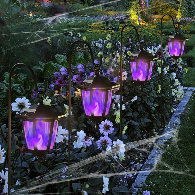 Alt view image 6 of 7 - 6 Pack Solar Halloween Flame Hanging Lights Outdoor, Flickering Flame LED Garden Lanterns with 4x38 Inch Shepherd Hooks, Landscape Lighting Waterproof for Lawn Yard Pathway Driveway, Purple