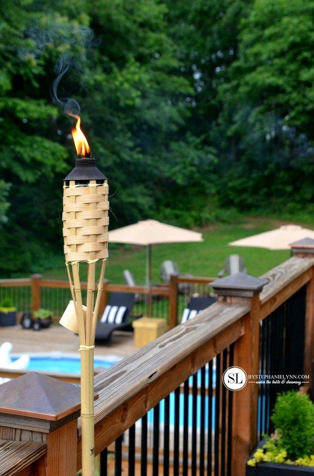 Alt view image 3 of 7 - Bamboo Torches 8-Pack Weather-Resistant Outdoor Décor with Easy-Pour Wide-Mouth Canister Refill for Patio, Garden, Backyard, and Parties, 57-Inch Citronella Torches