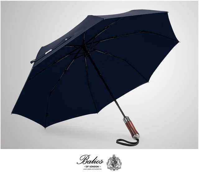 Alt view image 7 of 7 - Folding Umbrella Lux Hardwood Handle Auto Open Close Dark Navy | Patented handmade handle in richly grained solid hardwood, with stainless steel tip and wrist strap. Designed in London.