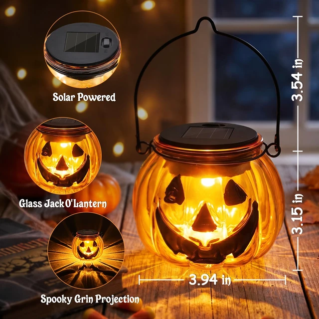 Alt view image 6 of 7 - Halloween Pumpkin Solar Lantern, 2 Pack Glass Hanging Light Outdoor | Orange Pumpkin JackO'-Lantern with Spooky Grin Face Projection; Tabletop Lamp; Auto On/Off; IP44 Waterproof; Warm White Glow
