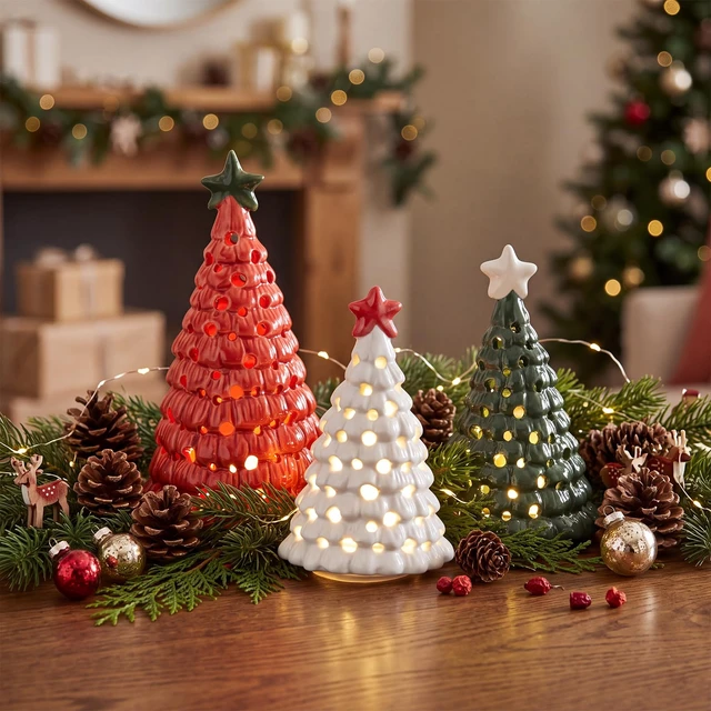 Alt view image 4 of 7 - 3 Pcs Mini Lighted Ceramic Christmas Tree Figurines, Red White Green
Illuminated Festive Display Decor with Star Toppers and Warm LED Glow for Tabletops, Mantels, Shelves and Centerpieces