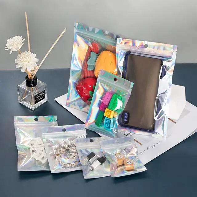 Alt view image 3 of 7 - 100 Pack Resealable Holographic Bags for Small Business (3 X 4 inches) | Iridescent Mylar Bags with Clear Front and Hanging Hole Smell-Proof Foil Pouches for Multipurpose Storage