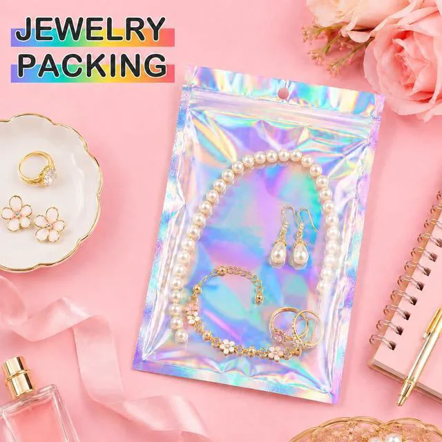 Alt view image 3 of 7 - 6.3x9.4 SmellProof Holographic Resealable Bag,Clear Mylar Favor Bag | 50 pcs Foil Pouch Bag,Zip Iridescent Party Favor Bag for Goodie,Candy,Treat,Food Storage,Jewelry,Packaging for Small Business