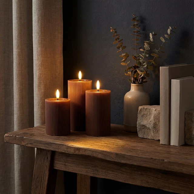 Alt view image 3 of 7 - Fluted Ribbed LED Pillar Candles, Brown, with Realistic Reflective Melted-Wax Effect Flickering Flame, Remote, Dimmable, Flameless, Battery Operated, Home & Wedding Decor (Set of 3)
