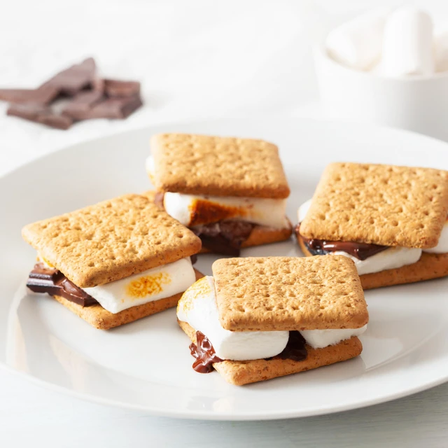 Alt view image 2 of 6 - Nostalgia Tabletop Indoor Electric S'mores Maker with Marshmallow Roasting Sticks and 4 Trays for Graham Crackers, Chocolate, and Marshmallows, Brown
